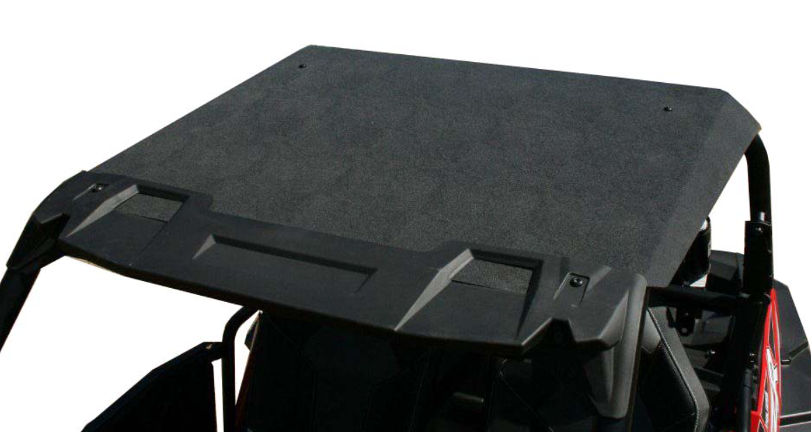 A close-up of the Polaris RZR 900/1000 ABS Plastic Hard Roof, mounted on the vehicle frame. The textured, angular black roof is shown above the roll cage and seats, highlighting its durable design and secure fit.