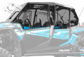 Close-up side view of a Polaris RZR XP 4 1000 with Hard Upper Doors in blue and black, featuring clear windows, bold geometric decals, and visible interior seats and steering wheel. The front and rear are softly blurred.