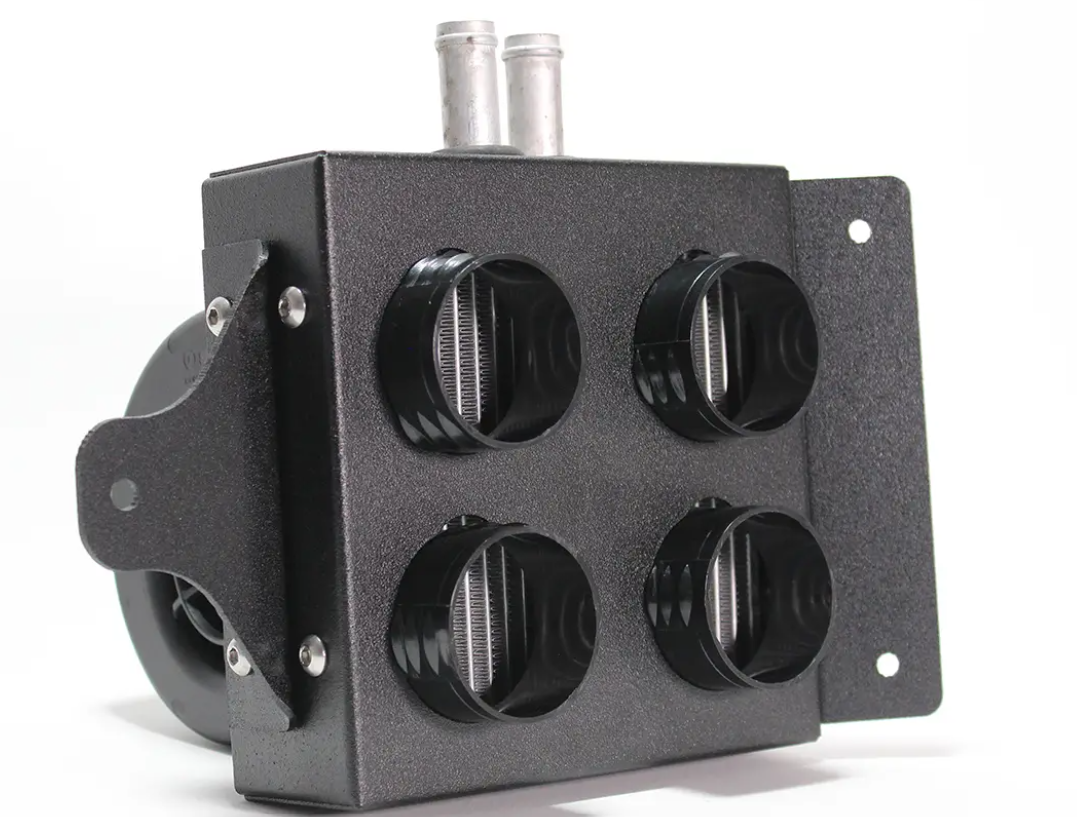 The Polaris RZR XP Turbo Cab Heater with Defrost (2016-2018) is a black metal unit featuring four front circular ports with filter threads, two top cylindrical connectors, a side mounting plate, and a round component on the left against a white background