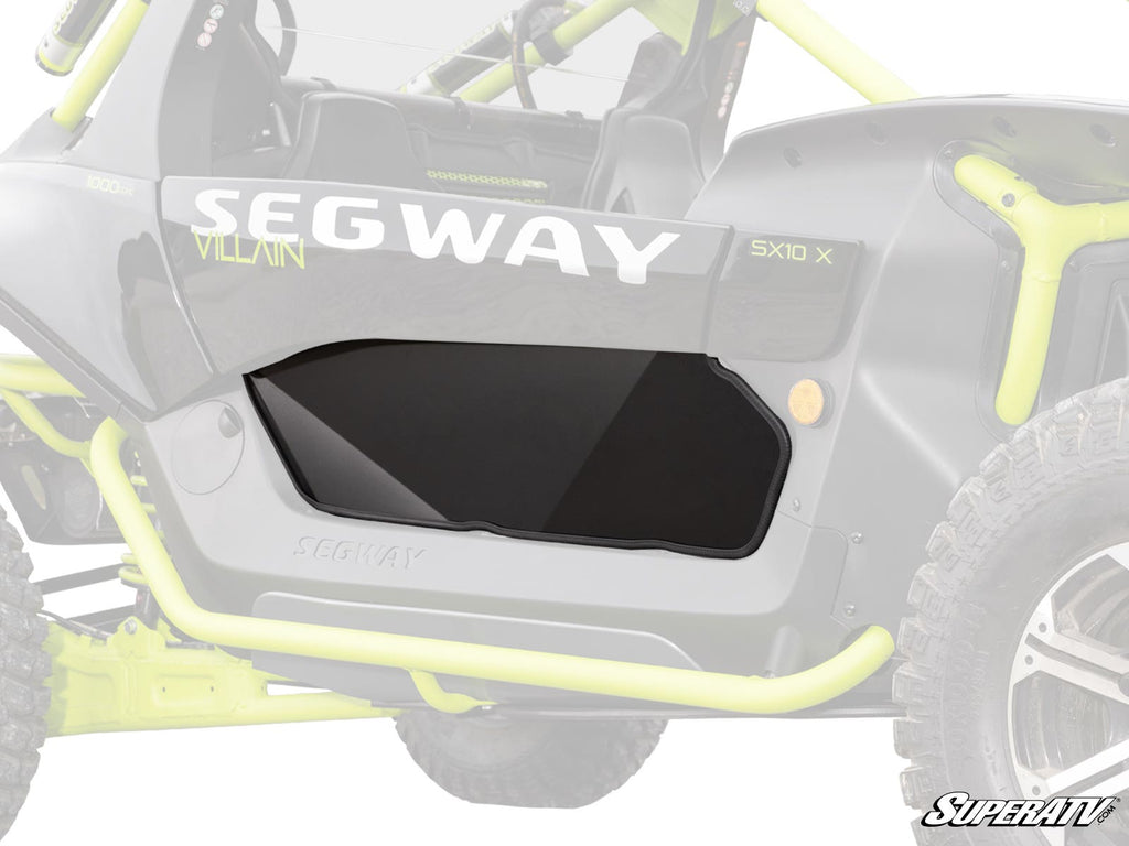 Close-up of the Segway Villain Lower Doors on a Villain SX10 X, showing the solid black door insert. Lime green roll bars, black bodywork, and a SUPERATV logo appear in the shot. Focus is on the lower door panel design.