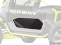 Close-up of the Segway Villain Lower Doors on a Villain SX10 X, showing the solid black door insert. Lime green roll bars, black bodywork, and a SUPERATV logo appear in the shot. Focus is on the lower door panel design.