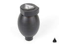 The Assault Industries Assault Army Grenade Shift Knob for Polaris RZR and Ranger is a matte black, grenade-shaped accessory with subtle grooves. It features white geometric logos on the top and bottom right corner, shown against a plain white background.