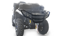 A Can Am Outlander G2 2019 ATV is shown from the front on a white background, featuring a prominent front bumper, large rugged tires, rear storage cases on the rack, and a winch with rope. The well-lit image highlights the ATV’s key details.