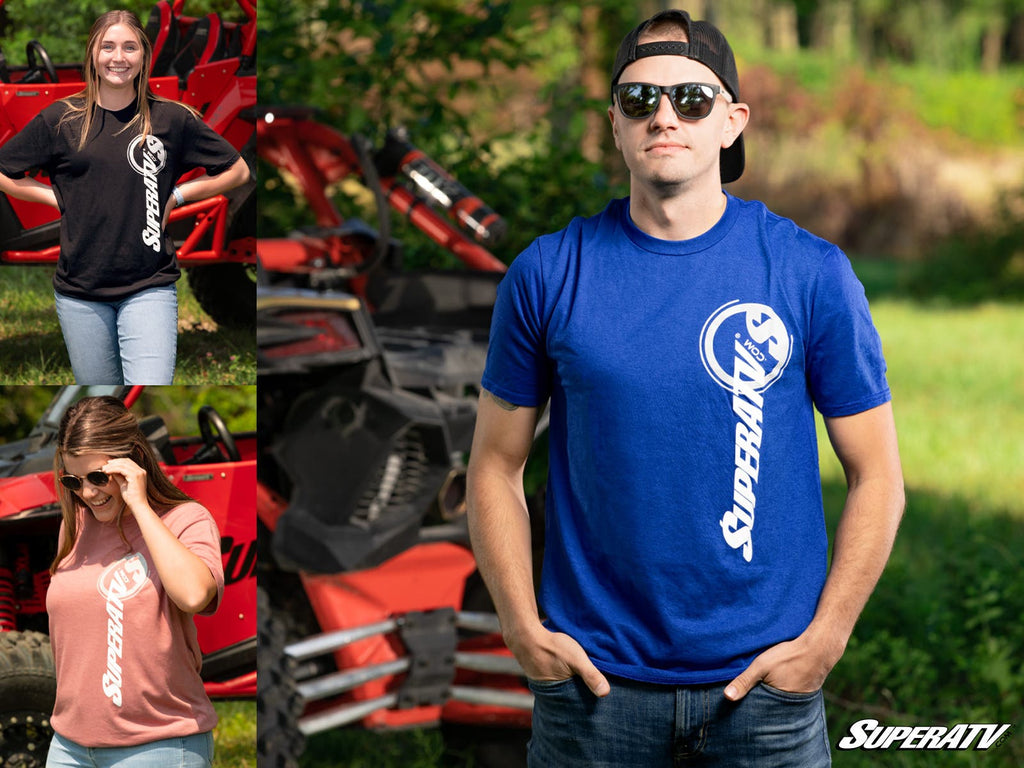 A collage shows three people outdoors modeling black, pink, and blue SuperATV Logo Unisex T-Shirts with bold white logos across the chest. A red off-road vehicle and green trees are in the background.