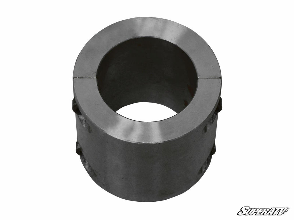 A Steel Tube Clamp with a circular center hole, visible top seam, smooth metallic surface, and side screws. The image features a white background and a “SuperATV” logo in the lower right corner.