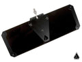 The Assault Industries Ghost Tinted Sun Visors (Set of 2) are black, rectangular metal visors with beveled edges and a central triangular mounting bracket featuring a bolt, screw at the top, and a small triangular logo. Background is plain white.