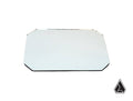 A rectangular Assault Industries Explorer Series Mirror Glass Replacement with beveled corners lies flat on a white background. In the bottom right corner, theres a black outlined prism-shaped logo.