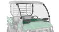 The Kawasaki Mule SX Scratch Resistant Windshield is installed on a green utility vehicle with a black roof. The clear windshield covers the front, features two black ventilation panels, and the rear is faded out to highlight the windshield.