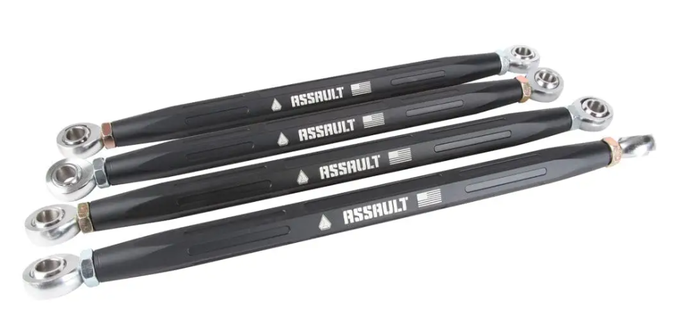 Four Honda Talon HD Turret Radius Rods, black metal with ASSAULT in white and a small American flag graphic, each fitted with silver rod end bearings, are neatly aligned parallel on a white background.