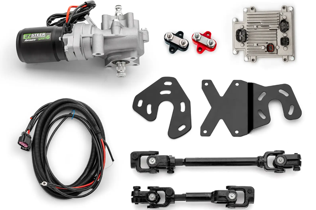 The Honda Talon 1000 EZ-Steer Series 6 Power Steering Kit is shown on a white background, featuring a motorized unit, wiring harness, metal brackets, two steering linkage rods, a control module, and red, blue, and black connectors.