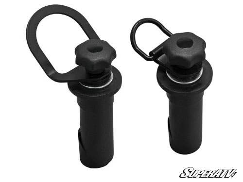 Two Polaris Ranger Latch and Go Tie Downs with black quick-release pins, pull rings, textured knobs, and washer gaskets are shown upright on a white background. The SuperATV logo appears in the lower right corner.
