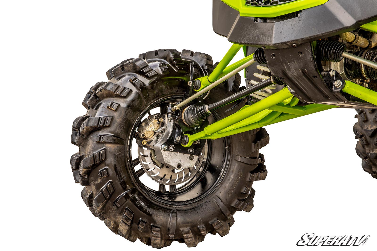 Close-up of a Textron Wildcat XX 6 Portal Gear Lift’s front left wheel with deep tread tires, visible suspension, disc brake, axle, and green chassis parts. Image has a white background with the “SuperATV” logo in the corner.