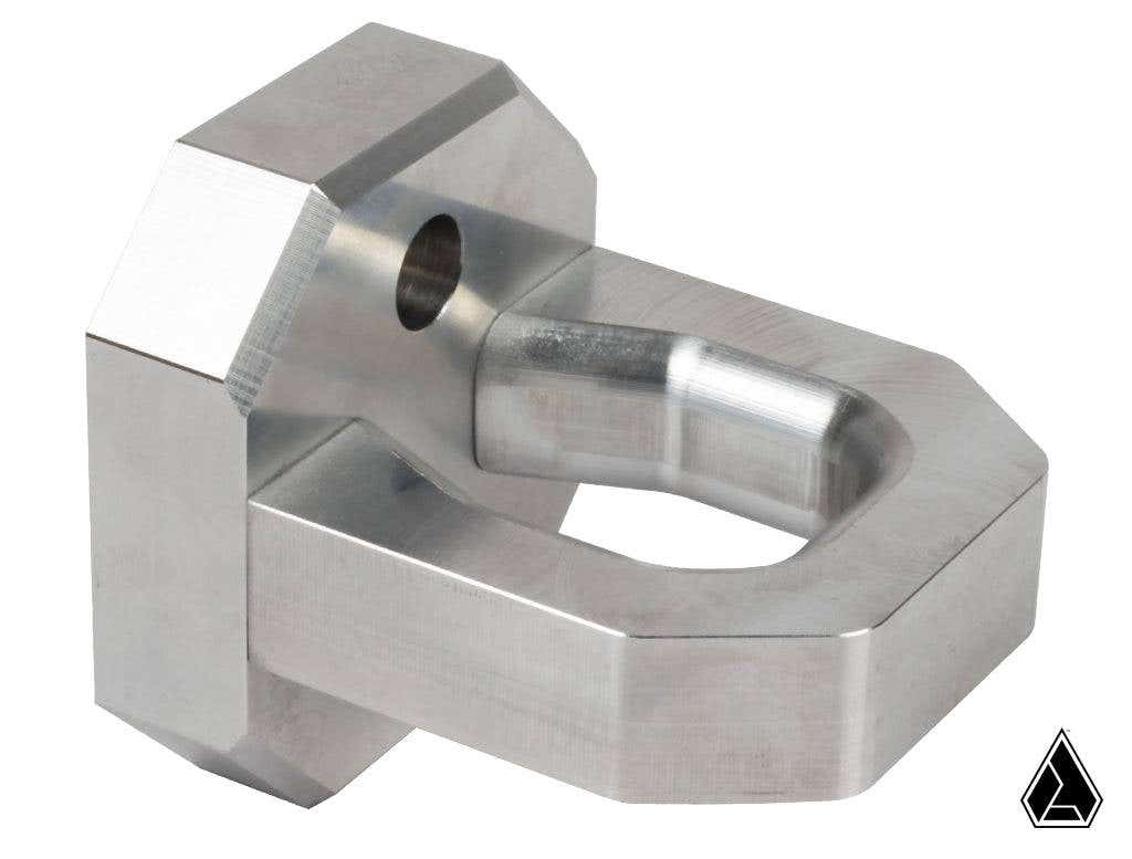 The image shows an Assault Industries Bold Bull Billet Tow Hook for Polaris UTVs—a machined metal part with a rectangular base, arched open hook, drilled hole near the bend, smooth finish, sharp edges, and a white background with a black geometric logo.