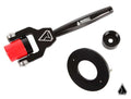 The Assault Industries RZR Secondary Belt Replacement Tool for select Polaris RZR Turbo models is shown in black and red with geometric logos, alongside two round black components, all made of metal and plastic on a white background.