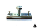 The Assault Industries Steering Wheel Removal Tool is a shiny, reflective, cylindrical metal clamp with two small screws on each end and a large hex bolt in the center, shown on a white background with a black geometric logo in the lower right.