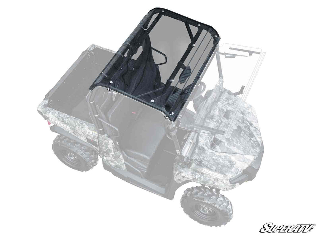 Top-down view of a Tracker 500S with a tinted roof and windshield, camo pattern, two seats, rear cargo bed, rugged tires, and SuperATV logo in the lower right corner.