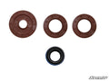 Four circular seals for the Polaris RZR Transmission Seal Kit are displayed on a white background: three brown seals of different sizes in the top row and one smaller black and blue seal in the bottom row. The SuperATV logo appears at the lower right.