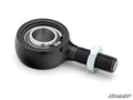 A close-up of the Honda Pioneer 1000 Heavy-Duty Tie Rod End Replacement Kit shows a black rod end bearing with a threaded shaft and silver hex nut on a white surface. The SuperATV logo is in the lower right corner.