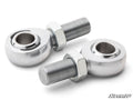 Two Heim Joint 3/4 parts with hexagonal nuts, featuring threaded shafts and circular eyes for mounting, are displayed on a white background. Both side and front views are shown, with the “SuperATV” logo in the bottom right corner.
