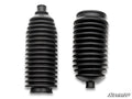 Two black rubber shock absorber boots with accordion-like ridges, narrow tapered ends, and wider bases are shown side by side on a white background. These are parts from the Honda Talon 1000R RackBoss 2.0 Steel Bar Tie Rod Kit.