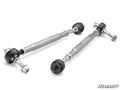 Two Yamaha Wolverine X2/X4 850 Heavy Duty Tie Rods with black ball joints and silver hex adjustment sleeves rest on a white background. Threaded ends have nuts and bolts attached, with a small “SuperATV” logo in the bottom right corner.