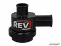 The SuperATV Turbo Charged Blow Off Valve is a black, cylindrical part with two short tube connections and features REV1 by SuperATV in bold white and red lettering on the side. The SuperATV logo appears in the image’s bottom right corner.