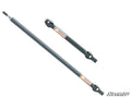 Two dark gray Polaris Ranger 1000 Diesel Heavy-Duty Prop Shaft Rhino Driveline shafts with orange “Rhino” labels are shown on a white background. One is diagonal and longer; the other is horizontal. The SuperATV logo appears in the lower right corner.