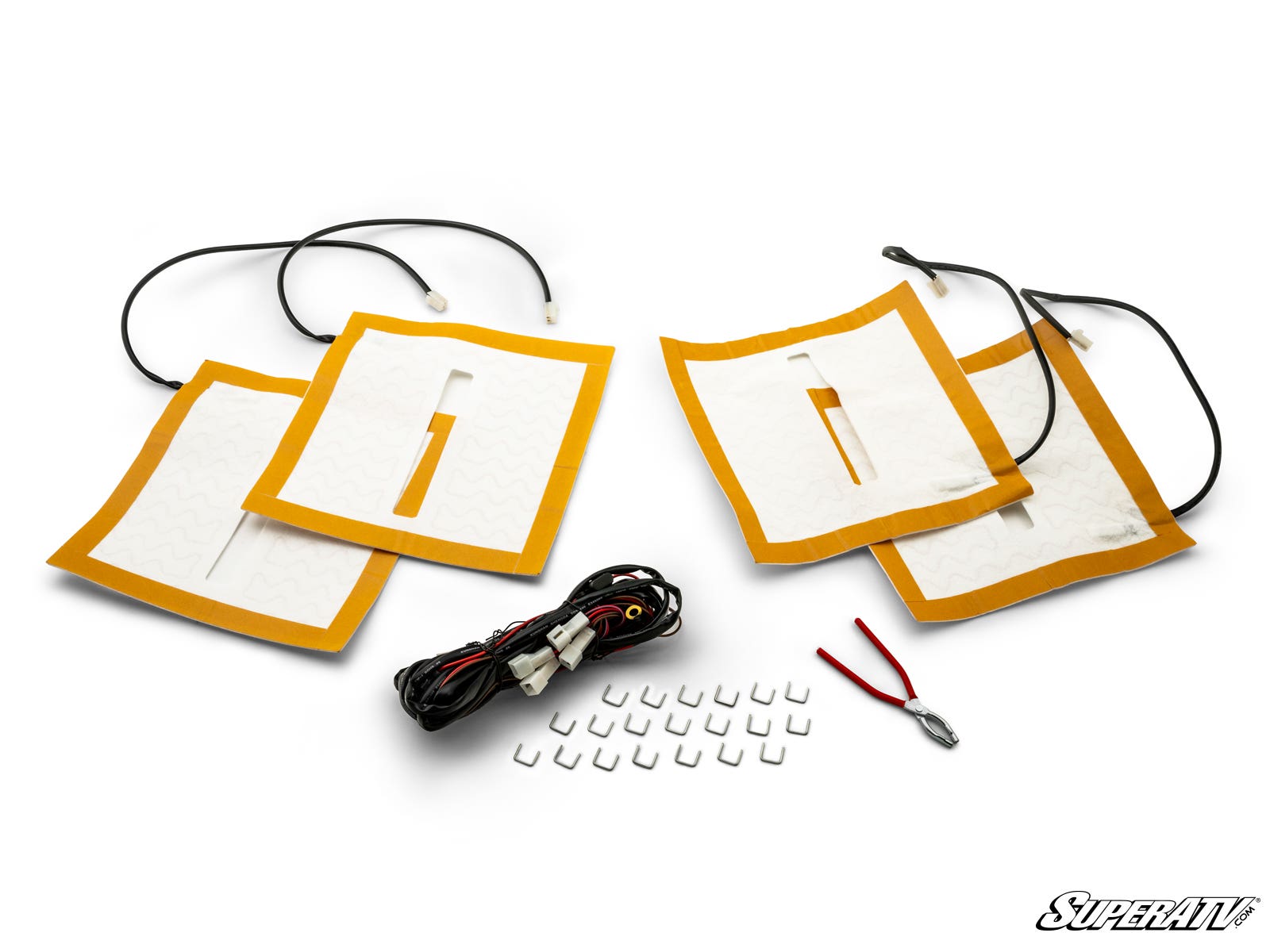 The Universal Heated Seat Kit includes four rectangular seat heater pads with wires, a wiring harness, white clips, a red-handled tool, and a small metal part. All items are arranged on a white background with the “SuperATV” logo in the bottom right corne