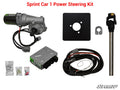Universal Sprint Car Power Steering Kit (220 W) with labeled parts: electric motor with wiring, black mounting plate, gray control box, wiring harness, metal bracket, steering shaft, and small hardware bags. Features SuperATV logo and kit name.
