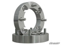 Two machined, circular Mini Truck 1 Wheel Spacers (4/110) with five threaded studs each are stacked on a white background. These metallic spacers are designed for automotive use, and the SuperATV logo is visible in the bottom right corner.