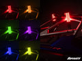A grid of seven images displays Magnum LED Whip Lights on an off-road vehicle, each in a different color: red, orange, yellow, green, blue, purple, and pink. Two red whips are mounted on the right; SuperATV logo is in the lower right.