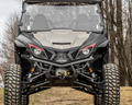 A front view of a black and gray Yamaha Wolverine X2/X4 1000 with a 3 Lift, featuring large rugged tires, angular headlights, and a mesh grille. The vehicle sits on uneven ground with visible suspension beneath the front bumper.