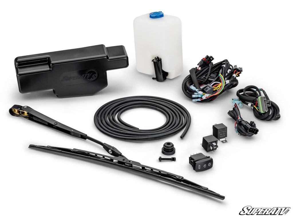 The Electric UTV Windshield Wiper Kit for SuperATV MaxDrive Power Flip Glass Windshields is shown laid out with a black fluid reservoir, white washer tank with blue cap, wiring, wiper arm and blade, nozzle, tubing, relays, switches, and connectors. SuperA