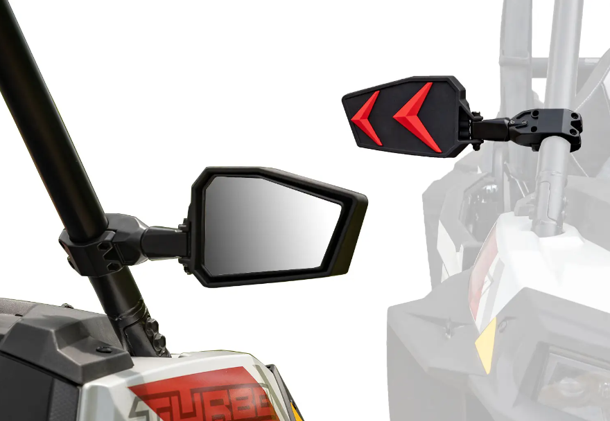 Close-up of Can-Am Maverick X3 Seeker Side Mirrors mounted on a roll cage; main angular mirror features a reflective surface, inset shows the back with bold red chevrons. Both have sturdy black frames for off-road use.