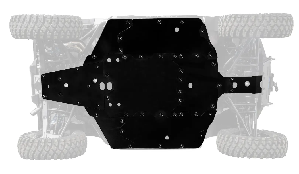 Top view of the Polaris Xpedition Full Skid Plate protecting the center and front chassis of an off-road vehicle. Rugged tires and suspension parts are visible behind the black plate, showcasing enhanced underbody protection.