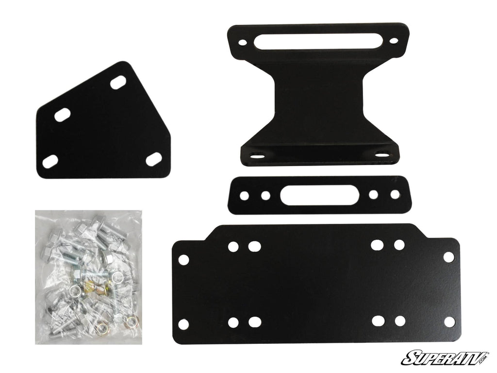 Four black metal brackets of various shapes and sizes with multiple bolt holes are arranged beside a clear bag of assorted hardware. The Yamaha Viking Winch Mounting Plate is shown, with the SuperATV logo in the bottom right corner.