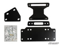 Four black metal brackets of various shapes and sizes with multiple bolt holes are arranged beside a clear bag of assorted hardware. The Yamaha Viking Winch Mounting Plate is shown, with the SuperATV logo in the bottom right corner.