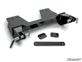The Yamaha Viking Plow Pro Snow Plow Mount is shown disassembled on a white background, featuring black metal brackets, two large mounting holes, latch pins, small rectangular plates, and an elongated flat bar. The SuperATV logo appears in the lower right
