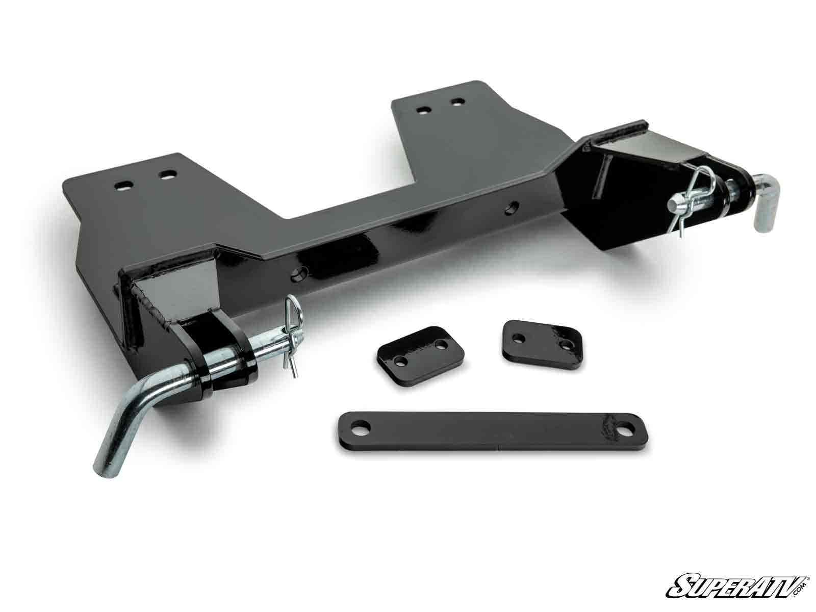The Yamaha Viking Plow Pro Snow Plow Mount is shown disassembled on a white background, featuring black metal brackets, two large mounting holes, latch pins, small rectangular plates, and an elongated flat bar. The SuperATV logo appears in the lower right