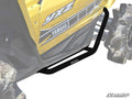 A yellow Yamaha YXZ is shown from the side, featuring black Yamaha YXZ Heavy Duty Nerf Bars along the lower edge for protection. Muddy rear wheels are partially visible, and the SuperATV logo appears in the lower right corner.