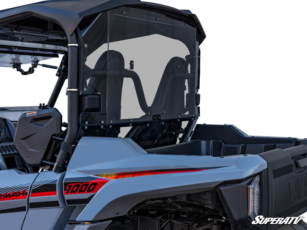 A close-up side view of a gray Yamaha Wolverine X2 1000 with a transparent rear windshield, black roll bars, red 1000 and Yamaha decals, rugged cargo bed, and the “SuperATV” logo in the bottom right corner.